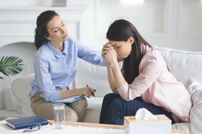 therapist comforting her patient